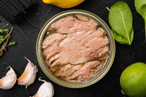 eating too much tuna symptoms.